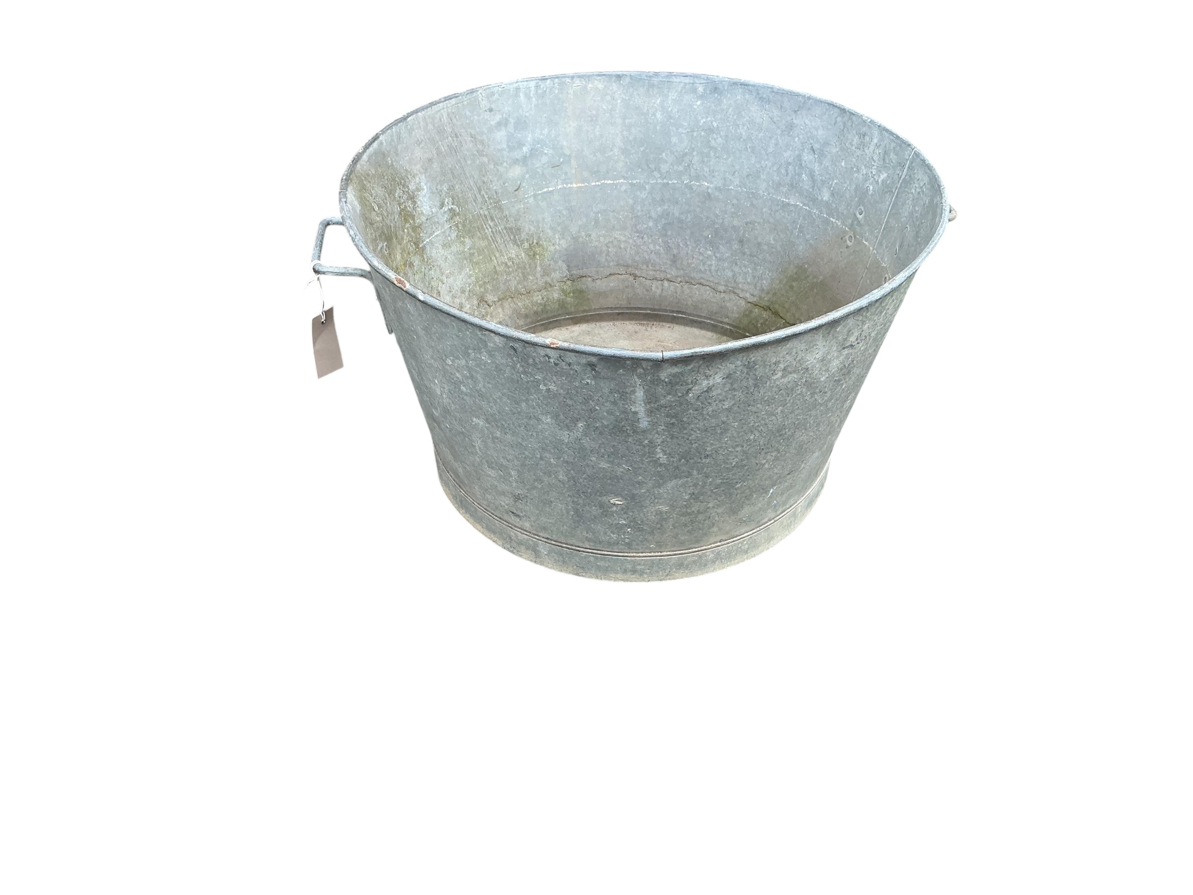 A vintage circular galvanised container, diameter 60cm, height 36cm